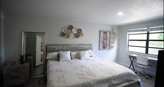 bedroom featuring a textured ceiling