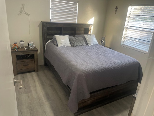 bedroom with hardwood / wood-style floors