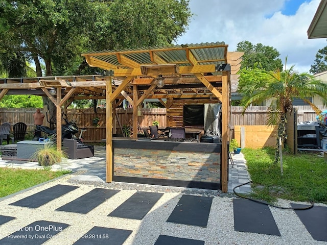 view of patio with an outdoor hangout area and a pergola