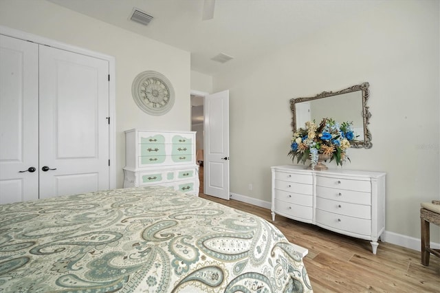 bedroom featuring light hardwood / wood-style flooring and a closet