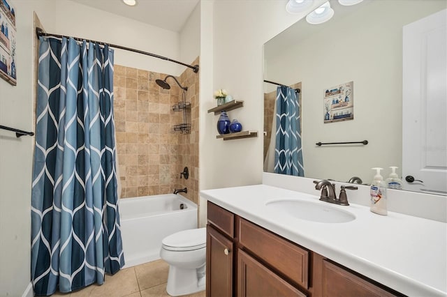 full bathroom with shower / tub combo with curtain, vanity, tile patterned floors, and toilet