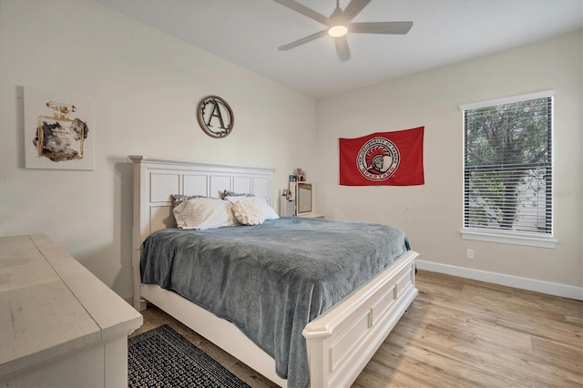 bedroom with light hardwood / wood-style floors and ceiling fan