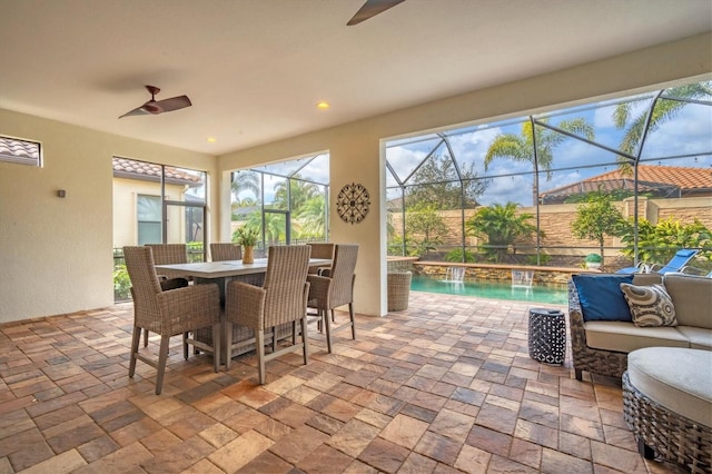 sunroom with ceiling fan