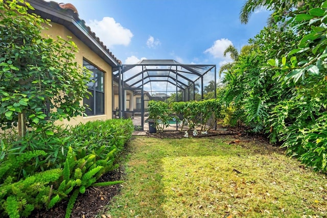 view of yard with a lanai