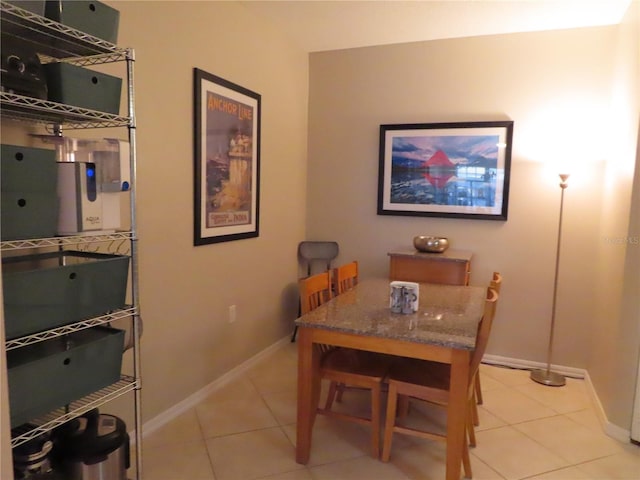 dining room featuring light tile patterned flooring