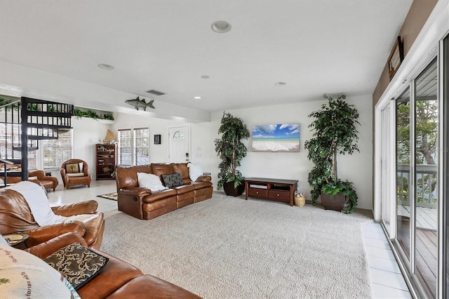 living room featuring plenty of natural light and light tile patterned flooring