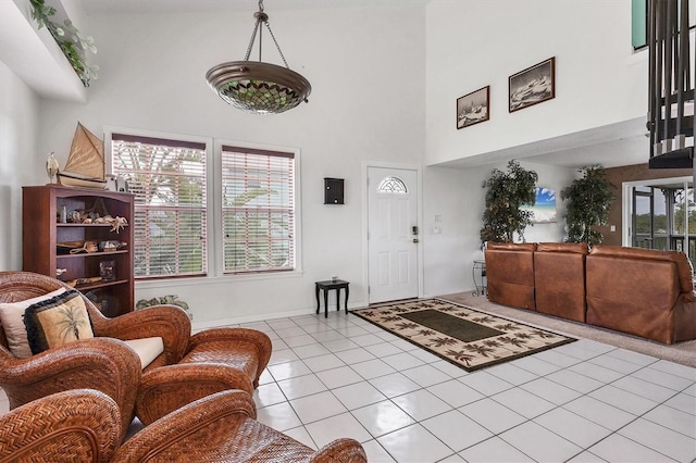 tiled entrance foyer with a high ceiling