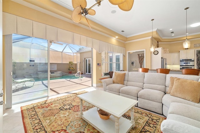 living room featuring ornamental molding and a raised ceiling