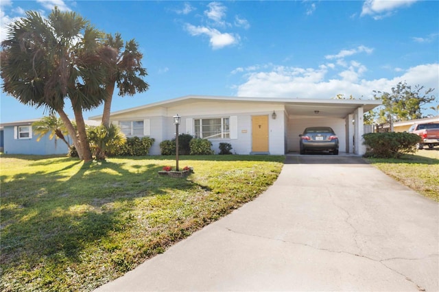 ranch-style home featuring a carport and a front lawn