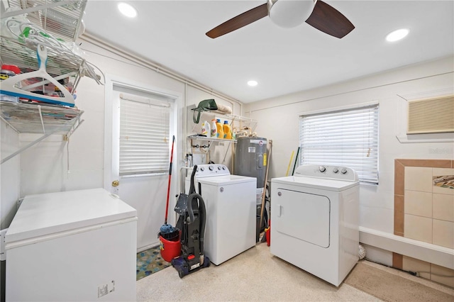 laundry room featuring ceiling fan, electric water heater, and washing machine and clothes dryer