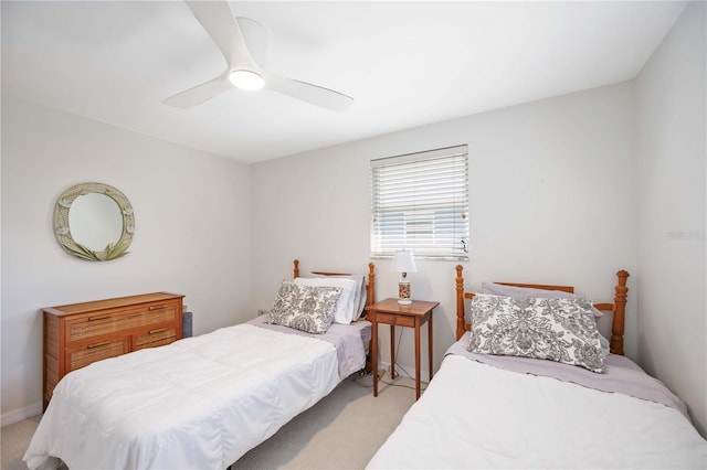 bedroom with ceiling fan and light colored carpet