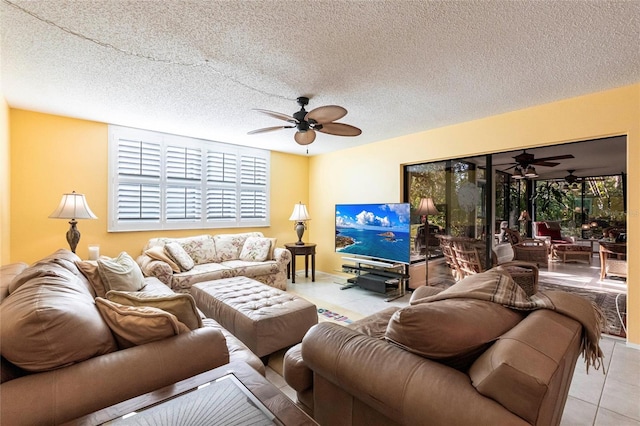 tiled living room with a textured ceiling and ceiling fan