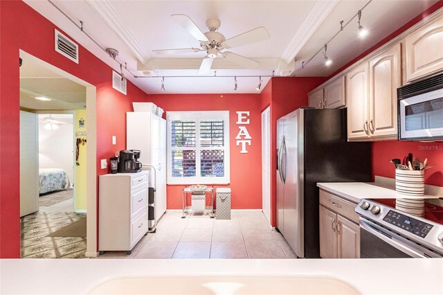 kitchen featuring light tile patterned floors, light brown cabinets, ornamental molding, ceiling fan, and stainless steel appliances