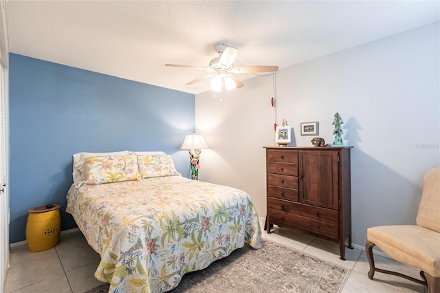 bedroom featuring light tile patterned floors and ceiling fan