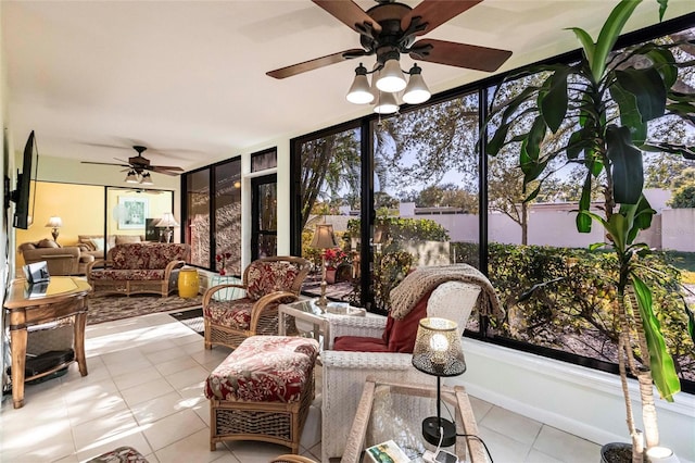 sunroom featuring ceiling fan