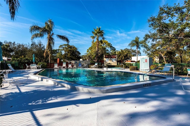 view of pool featuring a patio