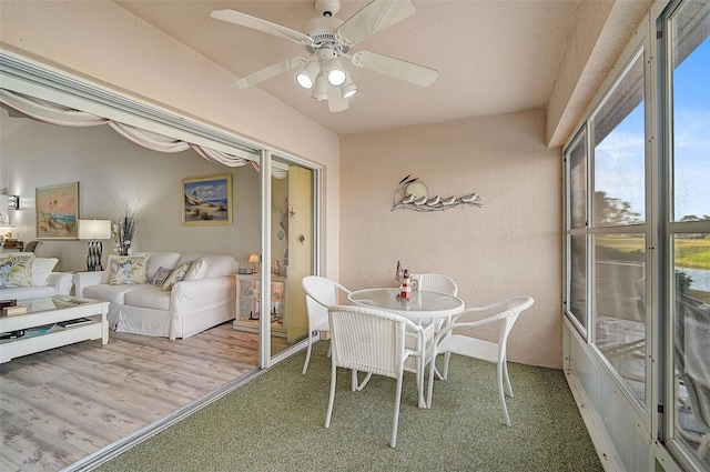 sunroom / solarium with ceiling fan