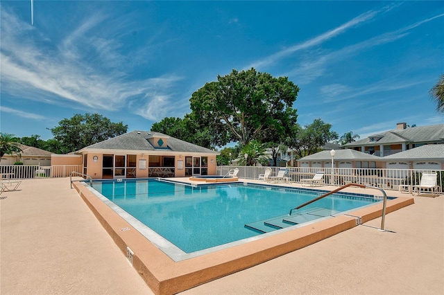 view of swimming pool featuring a patio