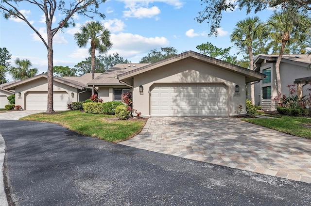 single story home featuring a garage