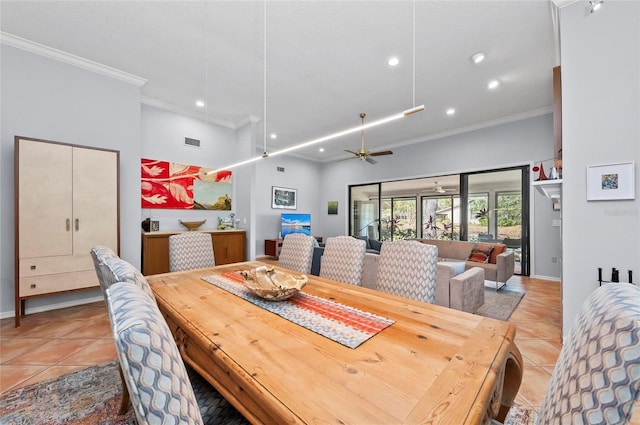 tiled dining room featuring a high ceiling, ornamental molding, and ceiling fan