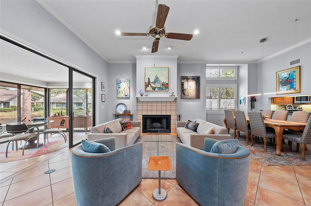 tiled living room with a tiled fireplace and ornamental molding