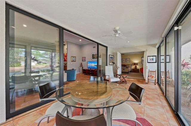 interior space with ceiling fan