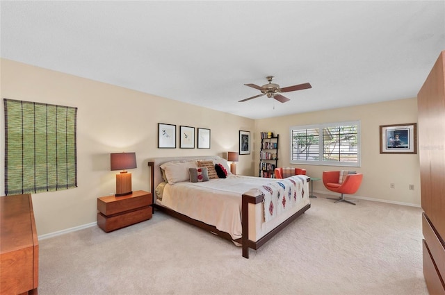 bedroom with light colored carpet and ceiling fan