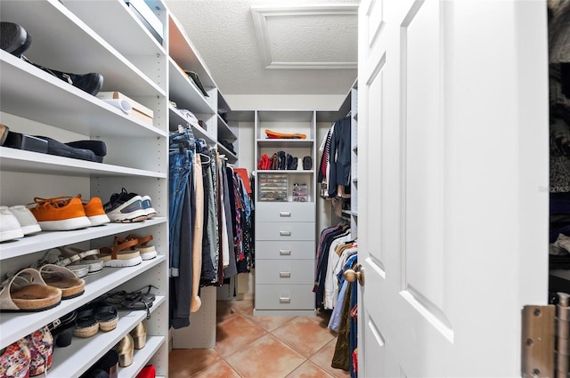 spacious closet featuring light tile patterned floors