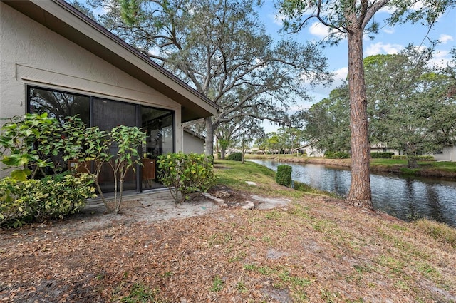 view of yard with a water view