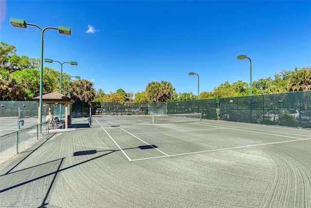 view of tennis court with a gazebo