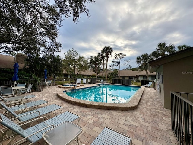 view of pool featuring a patio