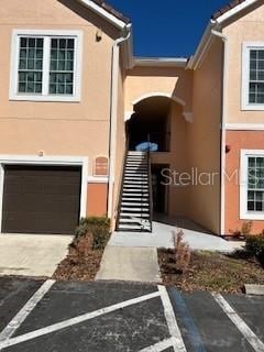 doorway to property featuring a garage