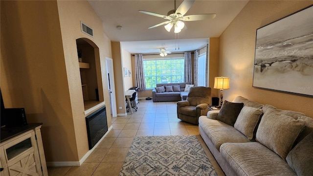 living room with light tile patterned flooring and ceiling fan