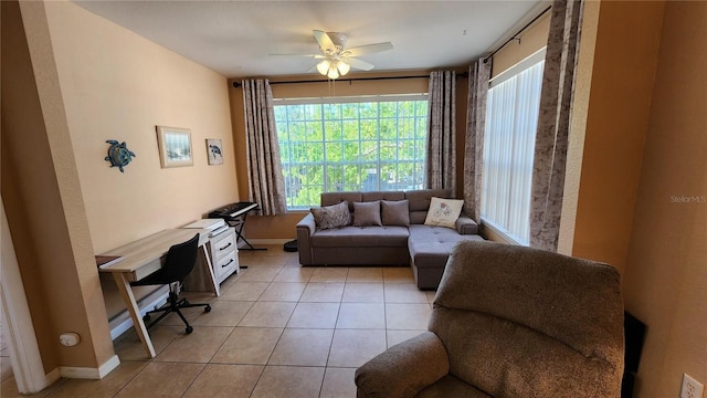 living room featuring ceiling fan and light tile patterned flooring