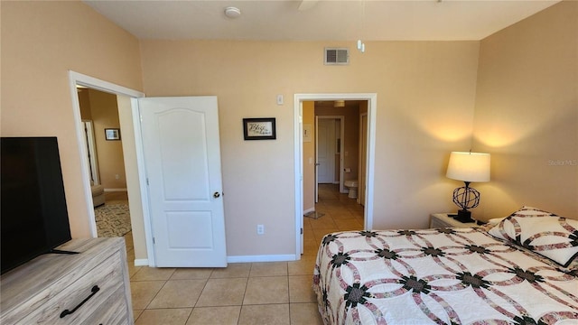 bedroom with light tile patterned flooring