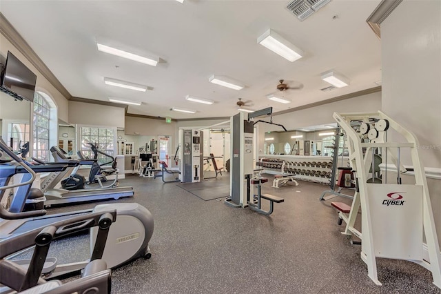 workout area featuring ornamental molding