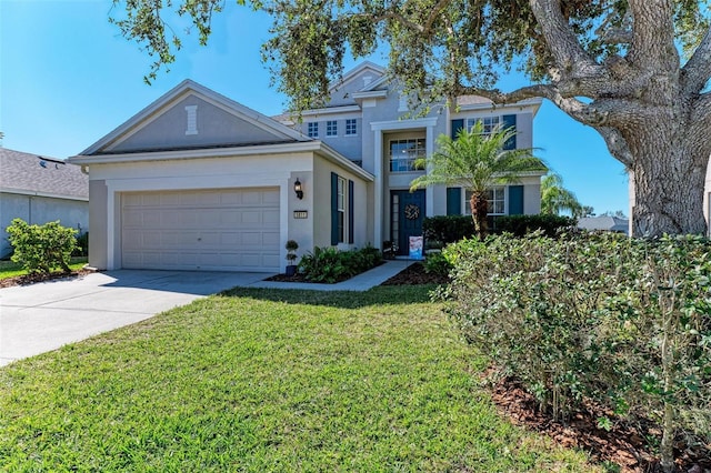 view of front of home featuring a garage and a front yard