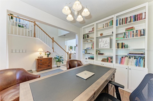 office space with a notable chandelier