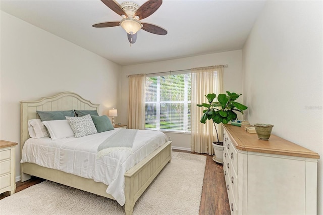 bedroom with ceiling fan and hardwood / wood-style floors