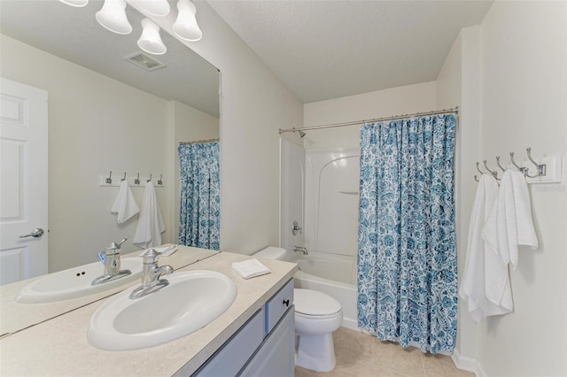 full bathroom featuring tile patterned flooring, vanity, shower / bath combo, and toilet