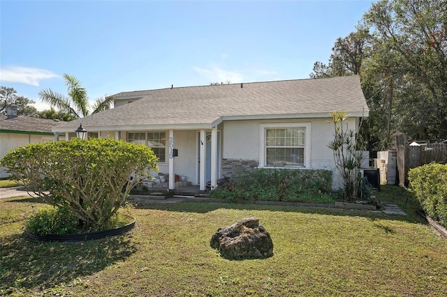 single story home featuring a front yard