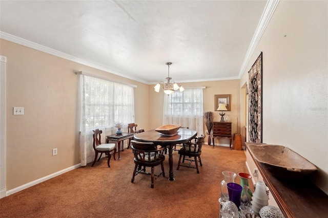 carpeted dining area featuring ornamental molding and a chandelier