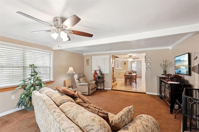 living room with crown molding, light colored carpet, and ceiling fan