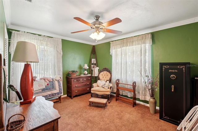 sitting room featuring crown molding, light colored carpet, and ceiling fan