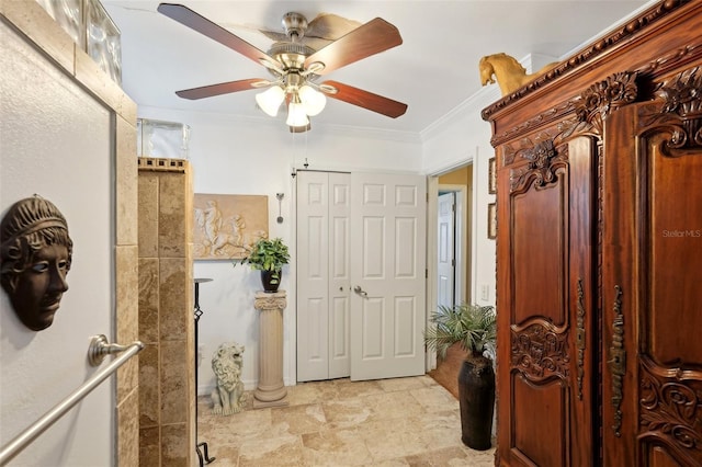 interior space with crown molding and ceiling fan