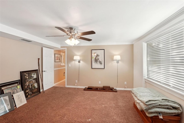 sitting room featuring light colored carpet and ceiling fan