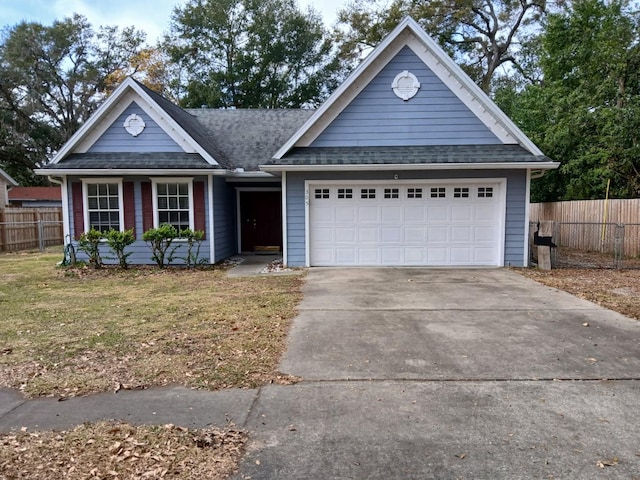 view of front facade with a garage and a front lawn