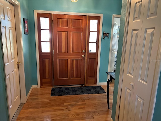 foyer with light wood-type flooring