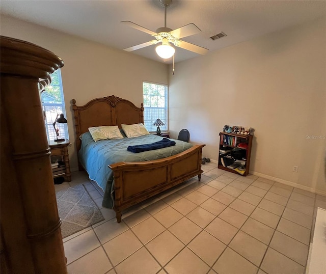 tiled bedroom with ceiling fan