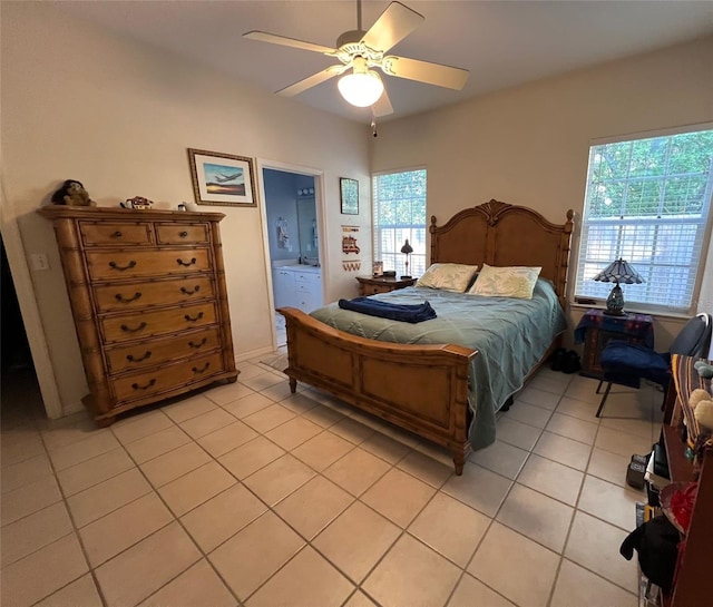 tiled bedroom with ceiling fan and ensuite bathroom